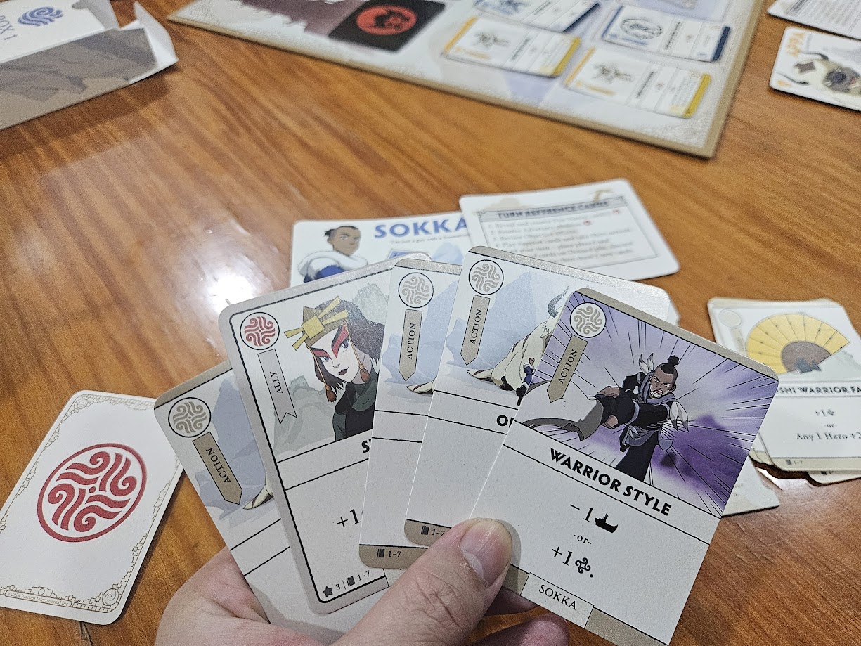 Gameplay photo of the board game Avatar: The Last Airbender – Aang's Destiny featuring various components and board state.