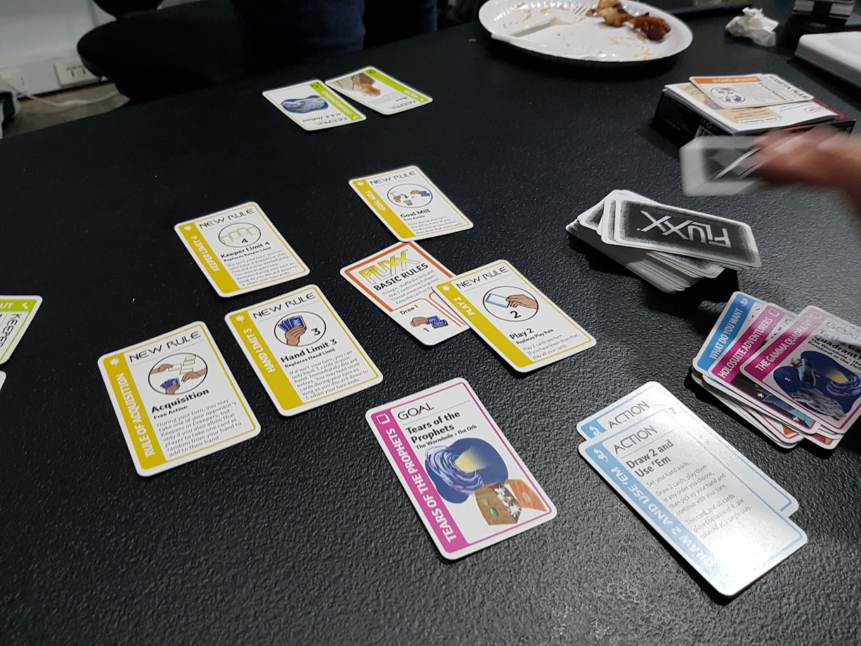 Gameplay photo of the board game Star Trek: Deep Space Nine Fluxx featuring various components and board state.