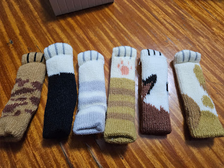 Gameplay photo of the board game Cat's Tsukiji featuring various components and board state.