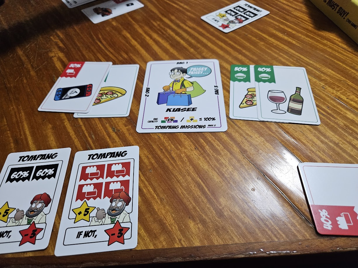 Gameplay photo of the board game Shop Until You Drop featuring various components and board state.