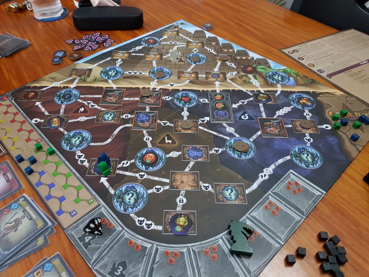 Gameplay photo of the board game Clank!: The Mummy's Curse featuring various components and board state.
