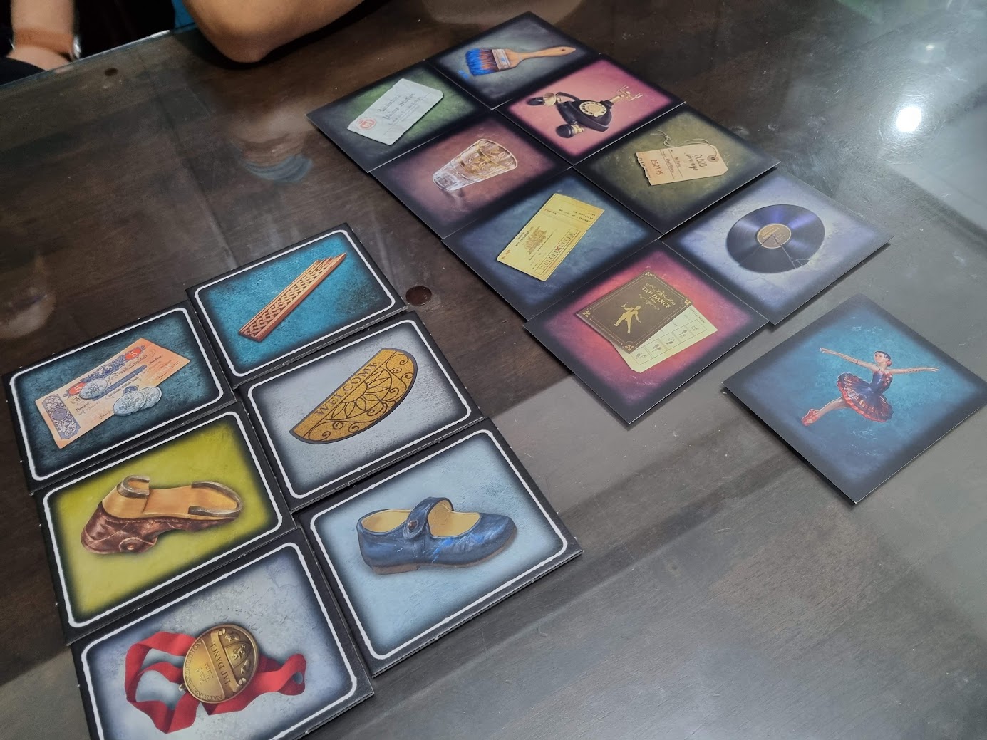 Gameplay photo of the board game echoes: The Dancer featuring various components and board state.