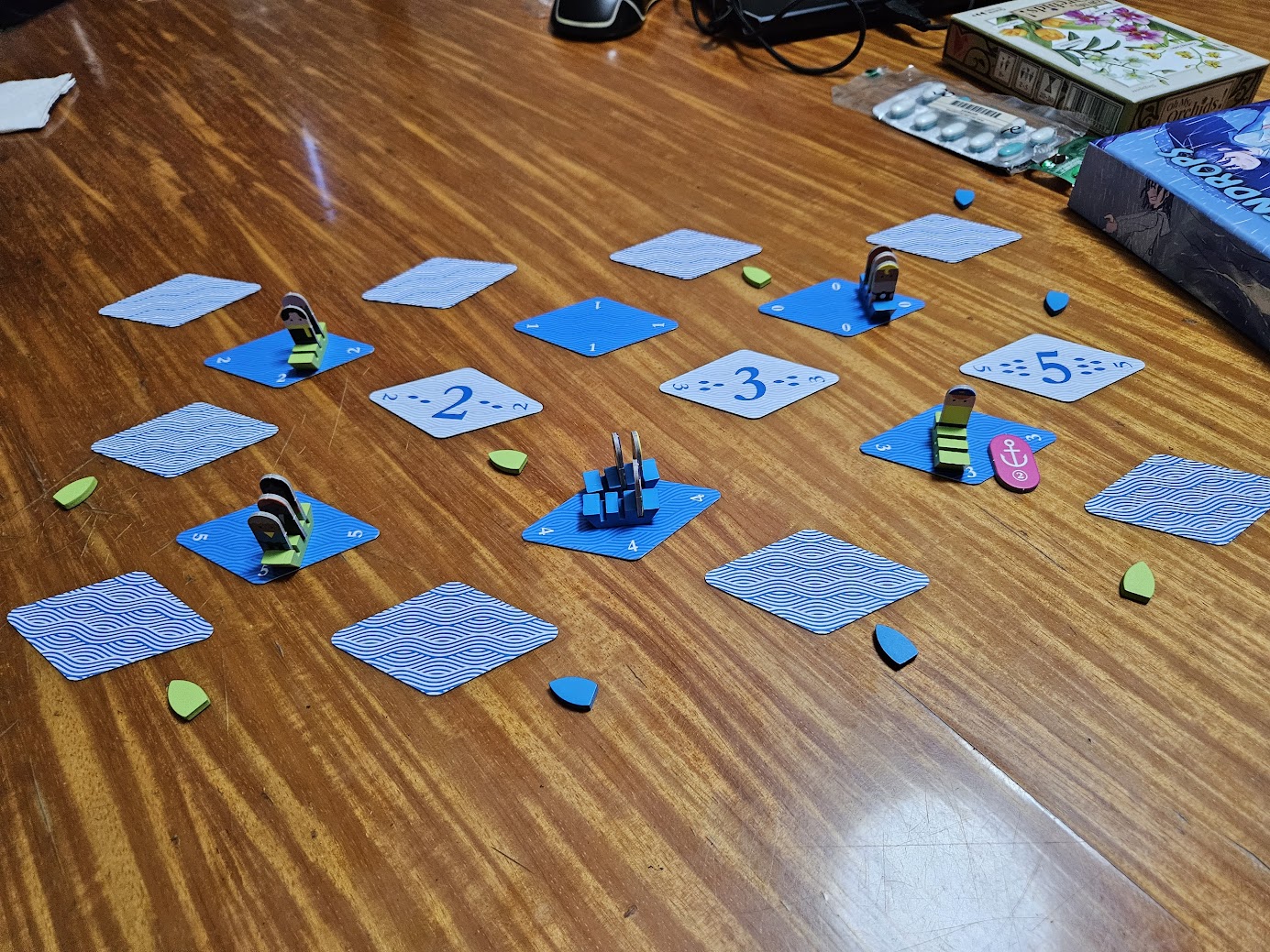 Gameplay photo of the board game Whale to Look featuring various components and board state.