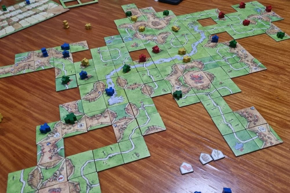 Gameplay photo of Carcassonne board game with a few expansions.