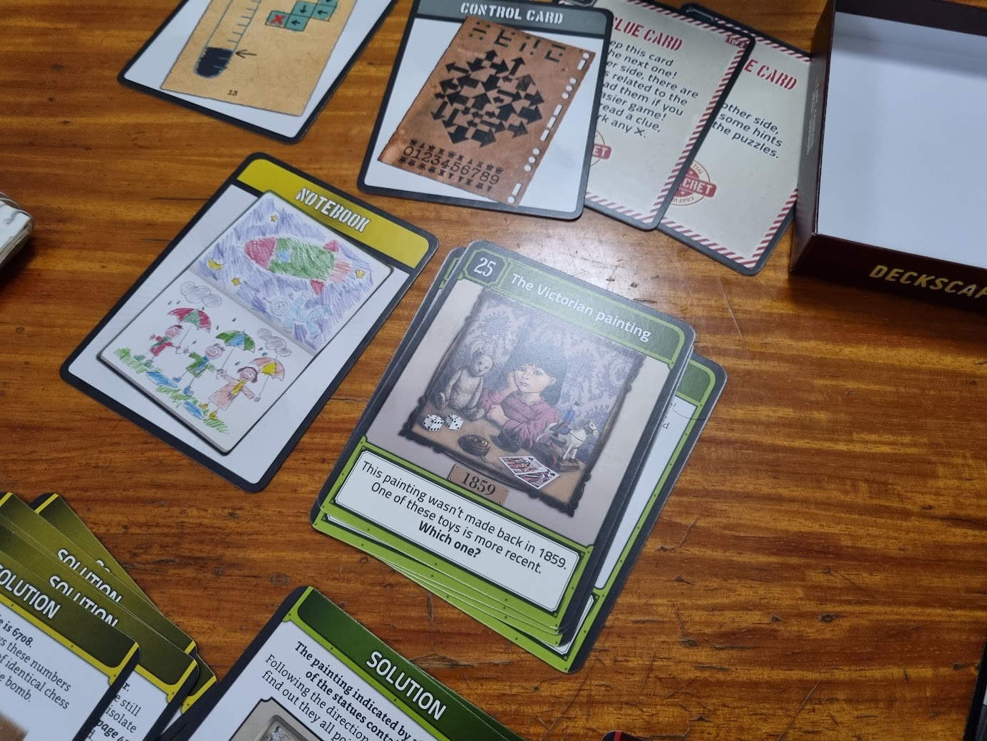 Gameplay photo of the board game Deckscape: The Fate of London featuring various components and board state.