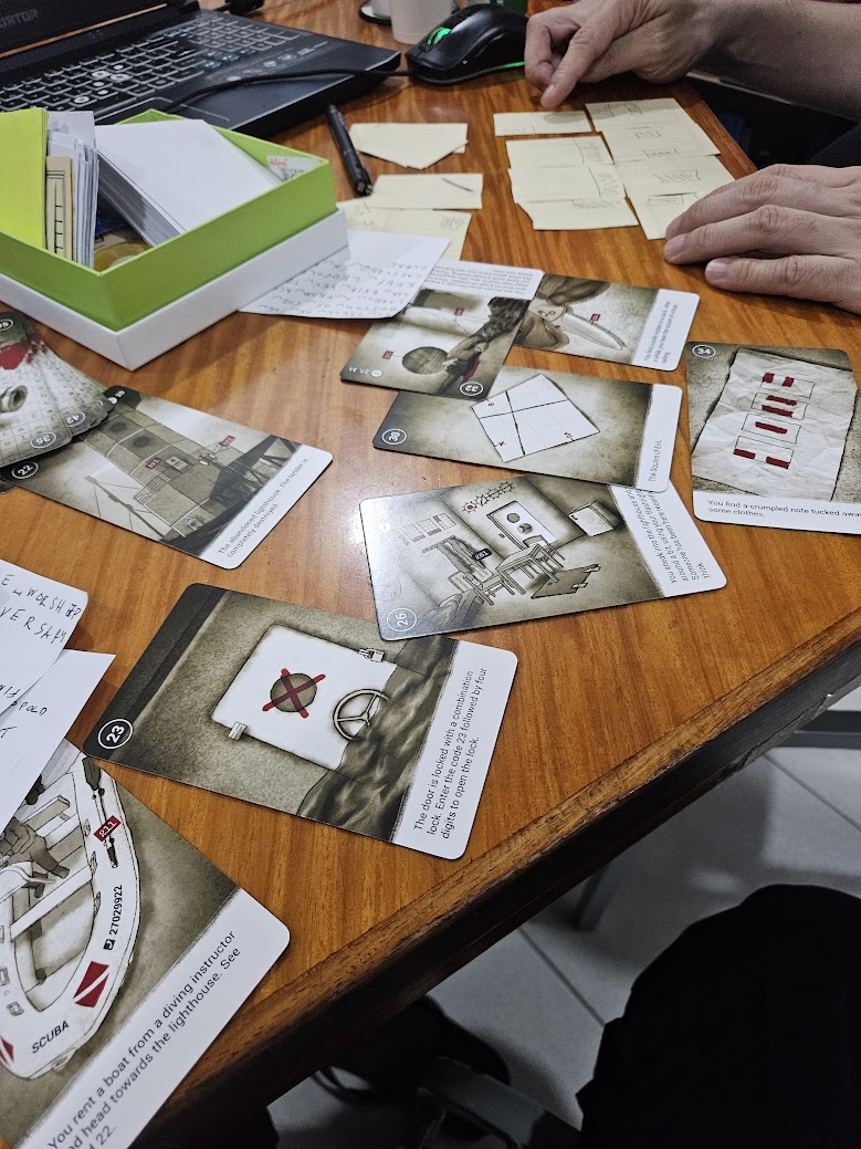 Gameplay photo of the board game 50 Clues: Keepers of Evil featuring various components and board state.
