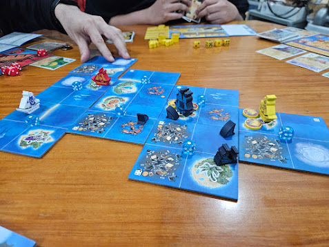 Gameplay photo of the board game Ahoy featuring various components and board state.