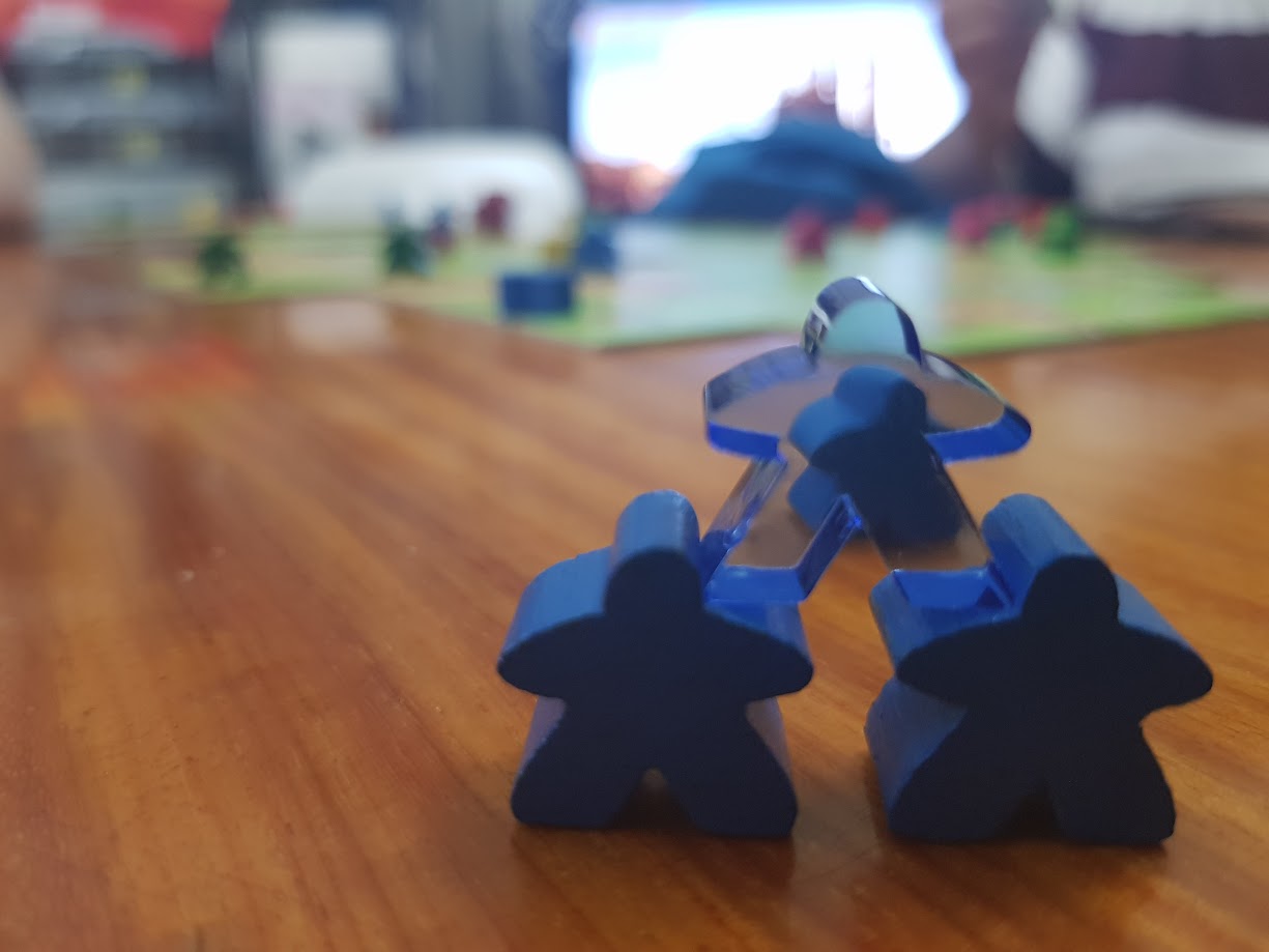Gameplay photo of the board game Carcassonne: The Phantom featuring various components and board state.