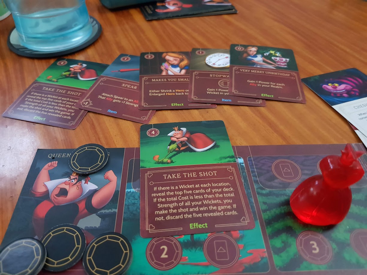 Gameplay photo of the board game Disney Villainous: The Worst Takes it All featuring various components and board state.