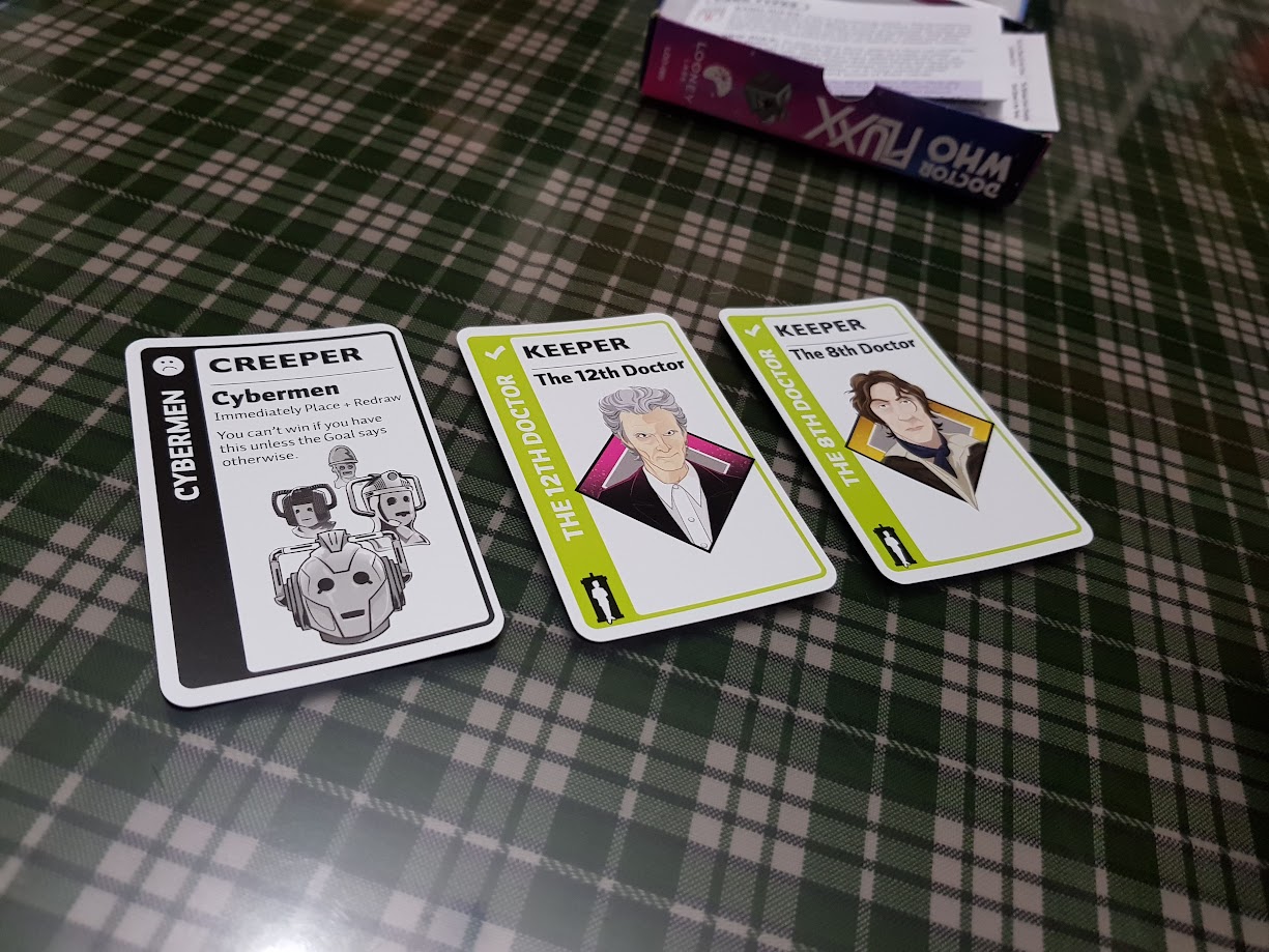 Gameplay photo of the board game Doctor Who Fluxx featuring various components and board state.