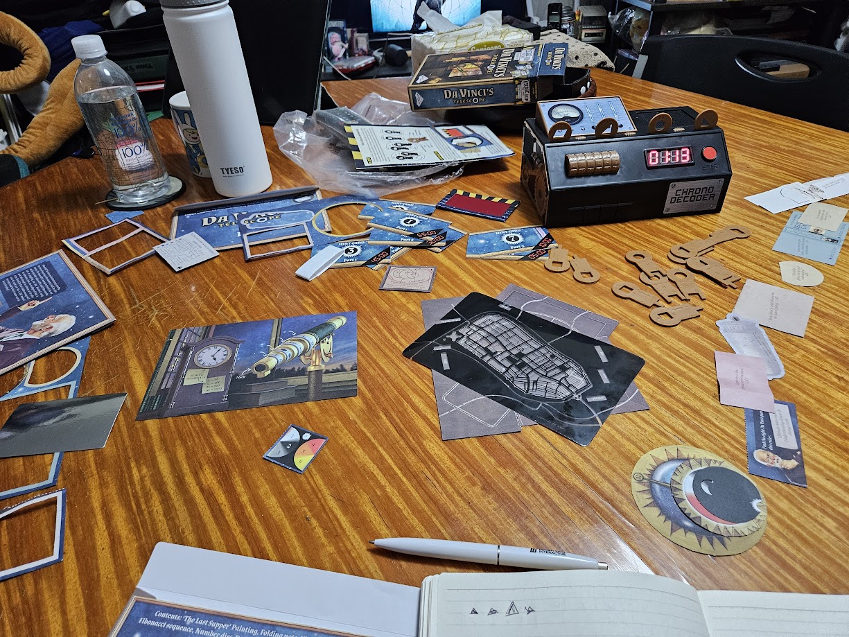 Gameplay photo of the board game Escape Room: The Game – Da Vinci's Telescope featuring various components and board state.