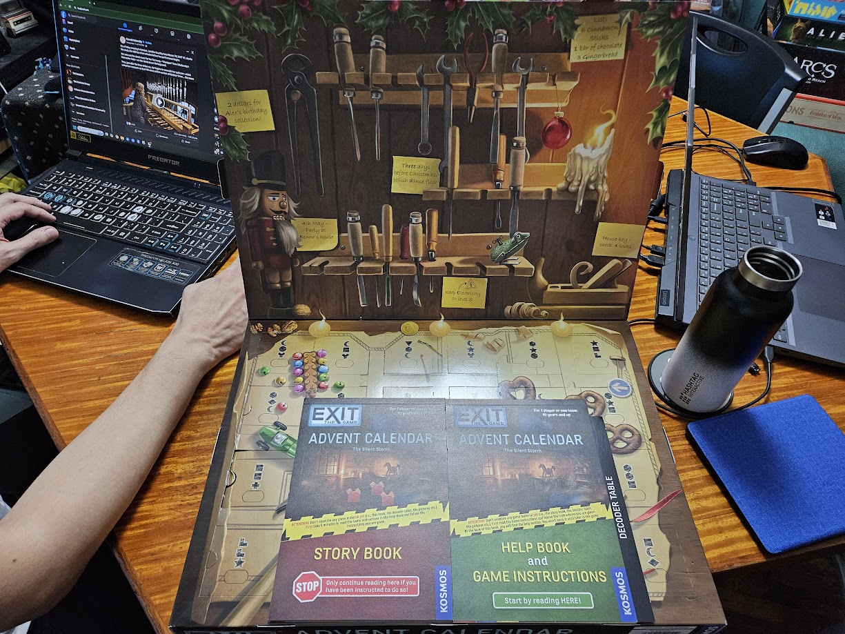 Gameplay photo of the board game EXIT: The Game – Advent Calendar: The Silent Storm featuring various components and board state.