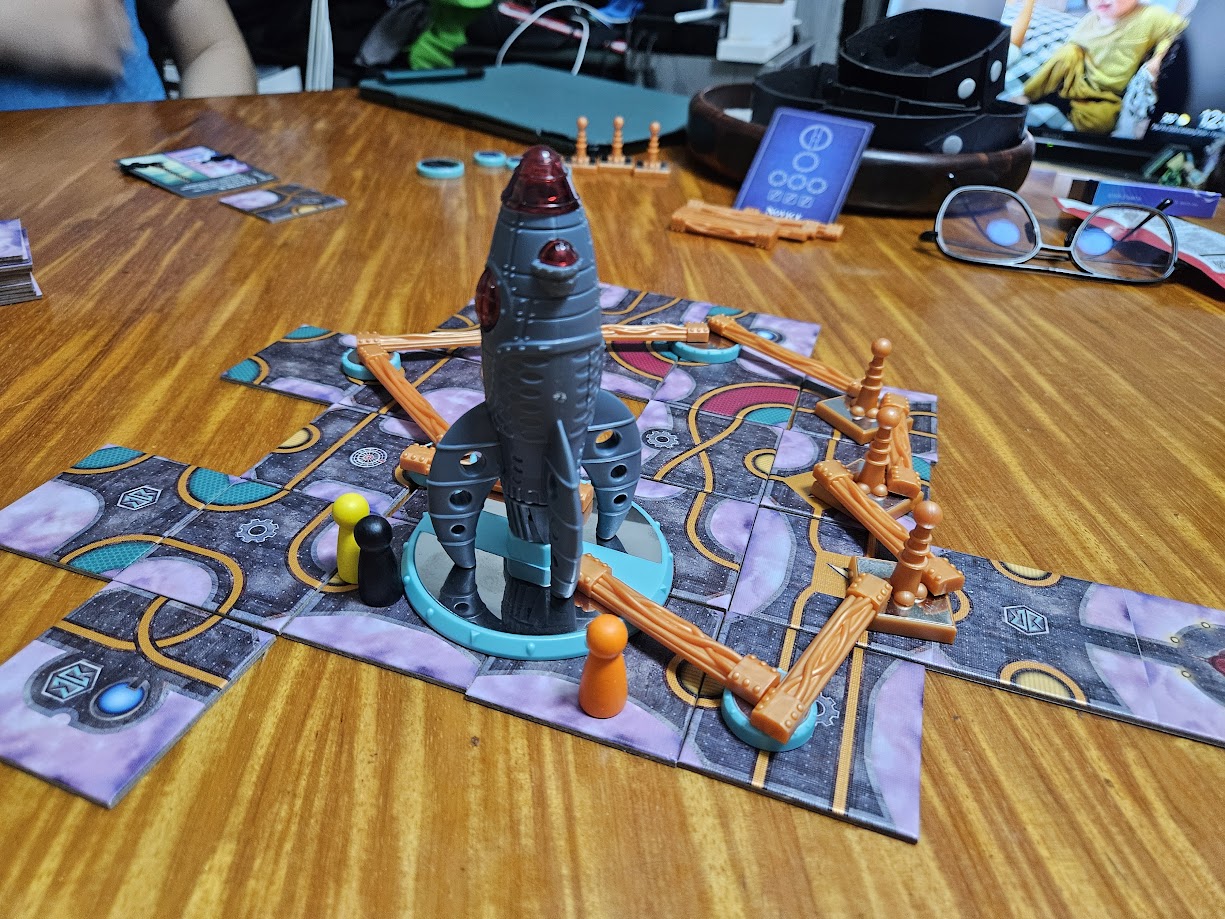 Gameplay photo of the board game Forbidden Sky featuring various components and board state.