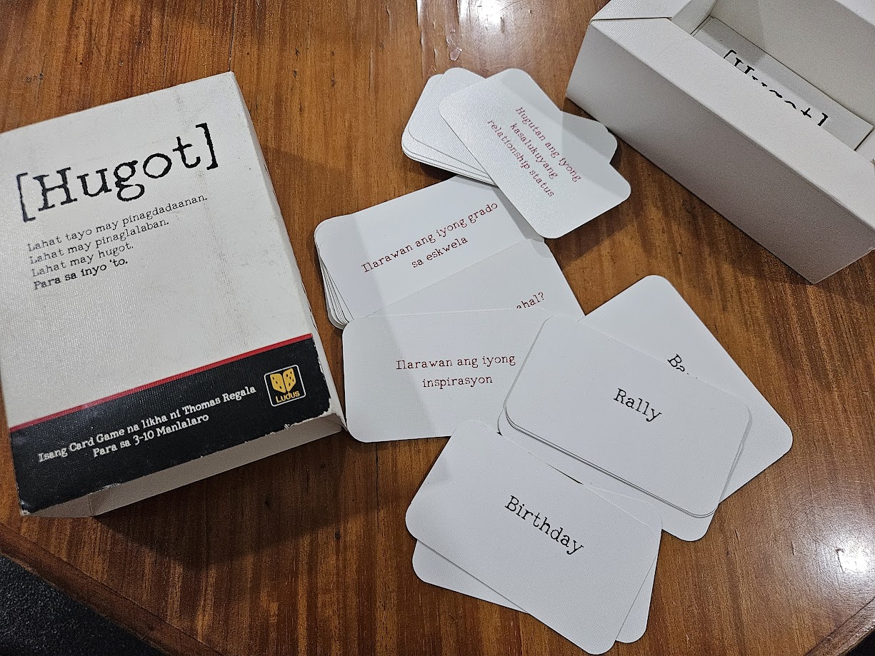 Gameplay photo of the board game Hugot featuring various components and board state.