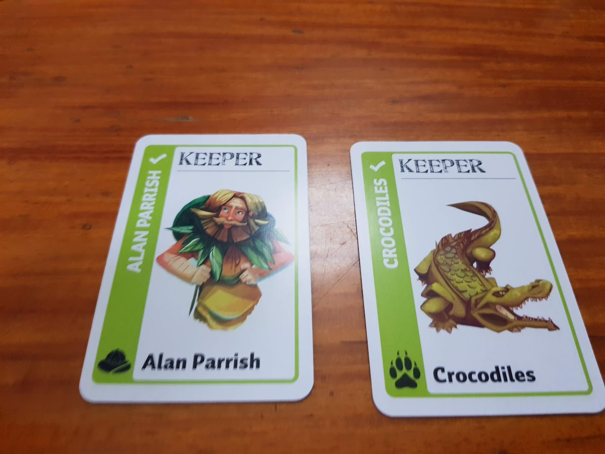 Gameplay photo of the board game Jumanji Fluxx featuring various components and board state.