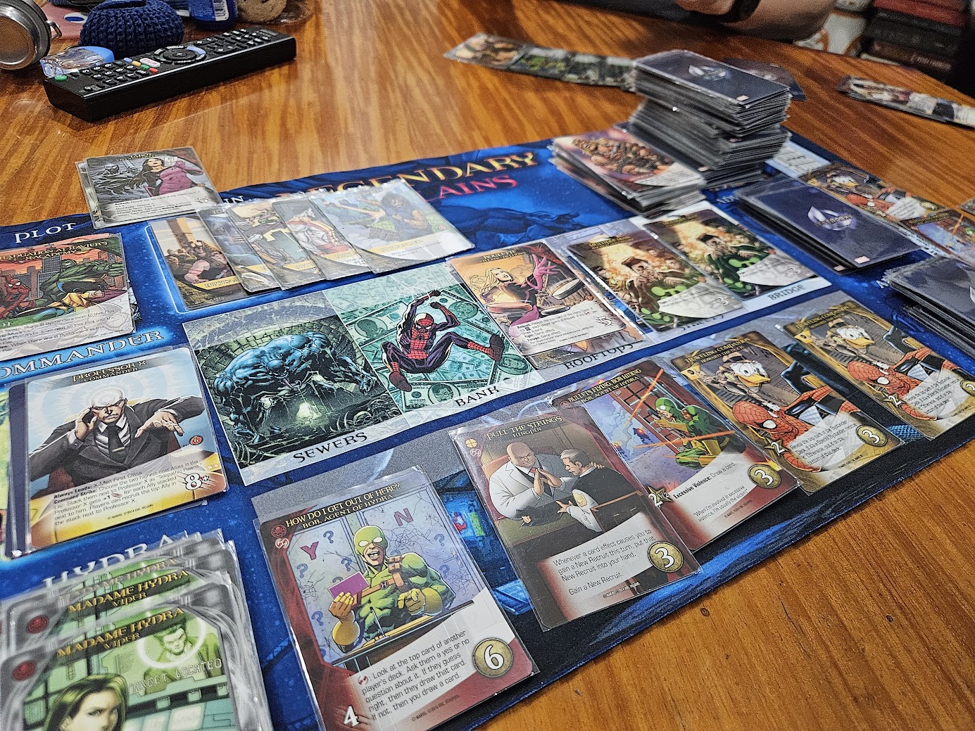 Gameplay photo of the board game Legendary: A Marvel Deck Building Game – Dimensions featuring various components and board state.