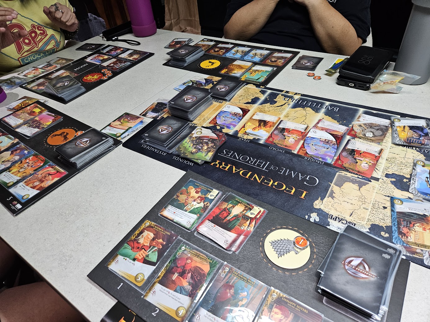 Gameplay photo of the board game Legendary: Game of Thrones Deck Building Game featuring various components and board state.
