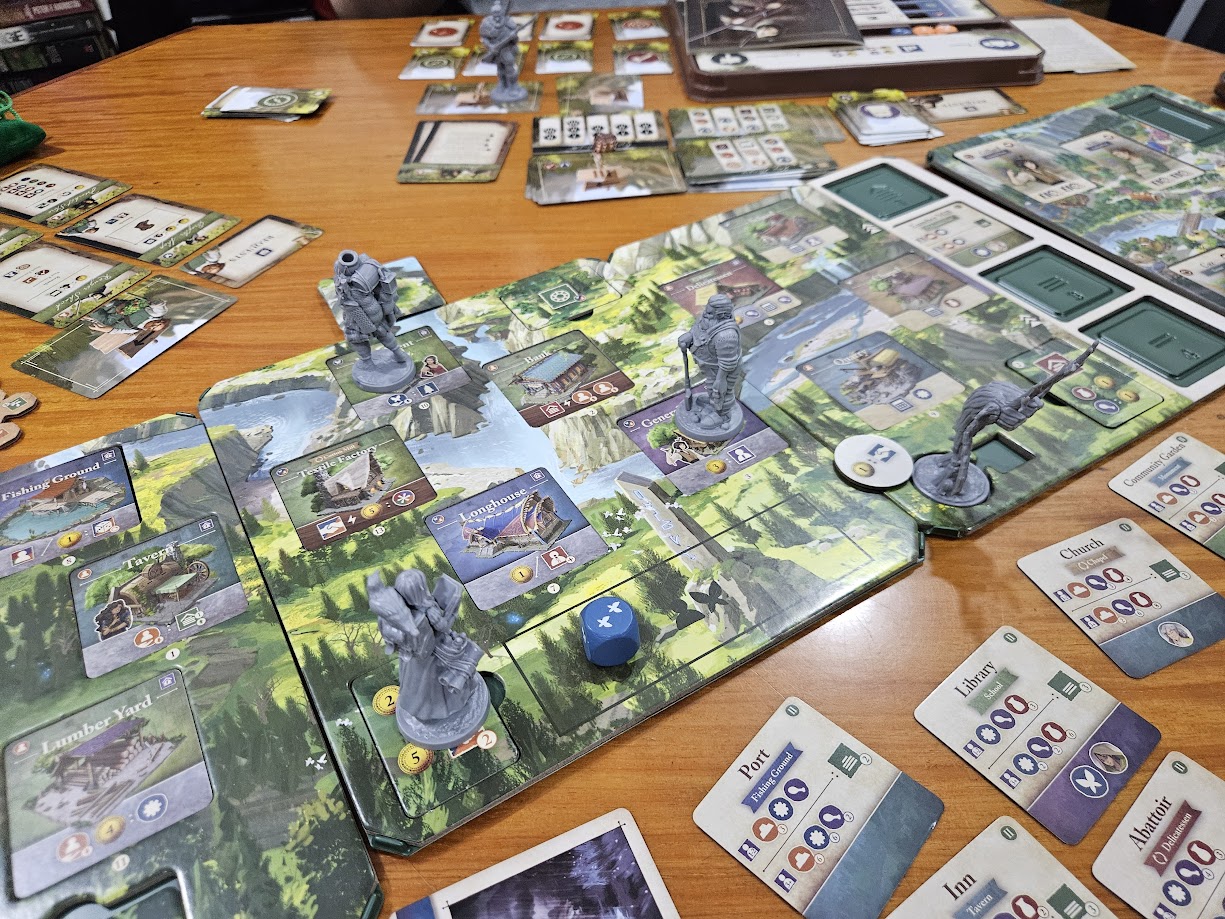 Gameplay photo of the board game Mythwind: Friends & Family featuring various components and board state.