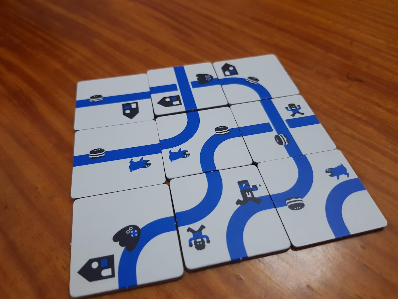 Gameplay photo of the board game Nine Tiles Panic featuring various components and board state.