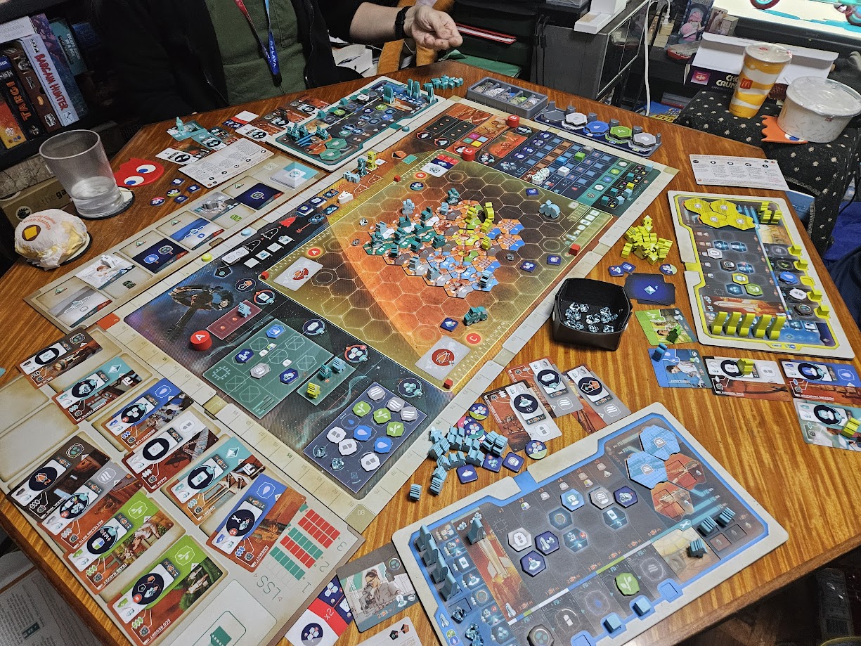Gameplay photo of the board game On Mars featuring various components and board state.
