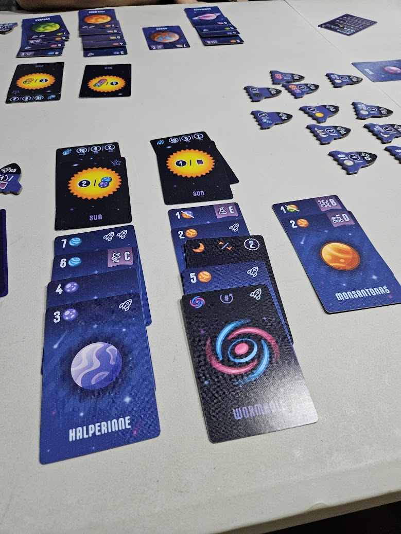 Gameplay photo of the board game Point Galaxy featuring various components and board state.