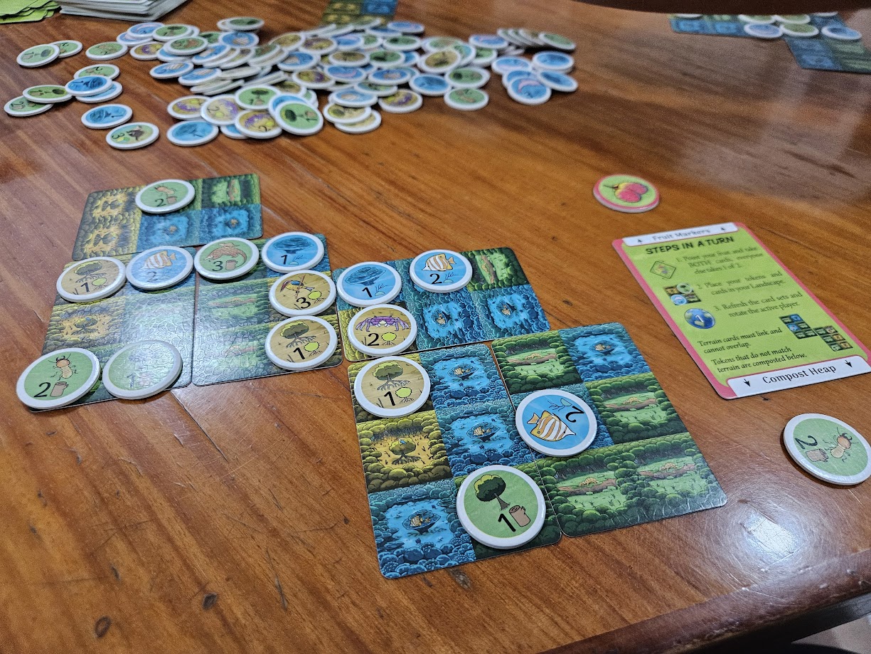 Gameplay photo of the board game Rainforest City featuring various components and board state.
