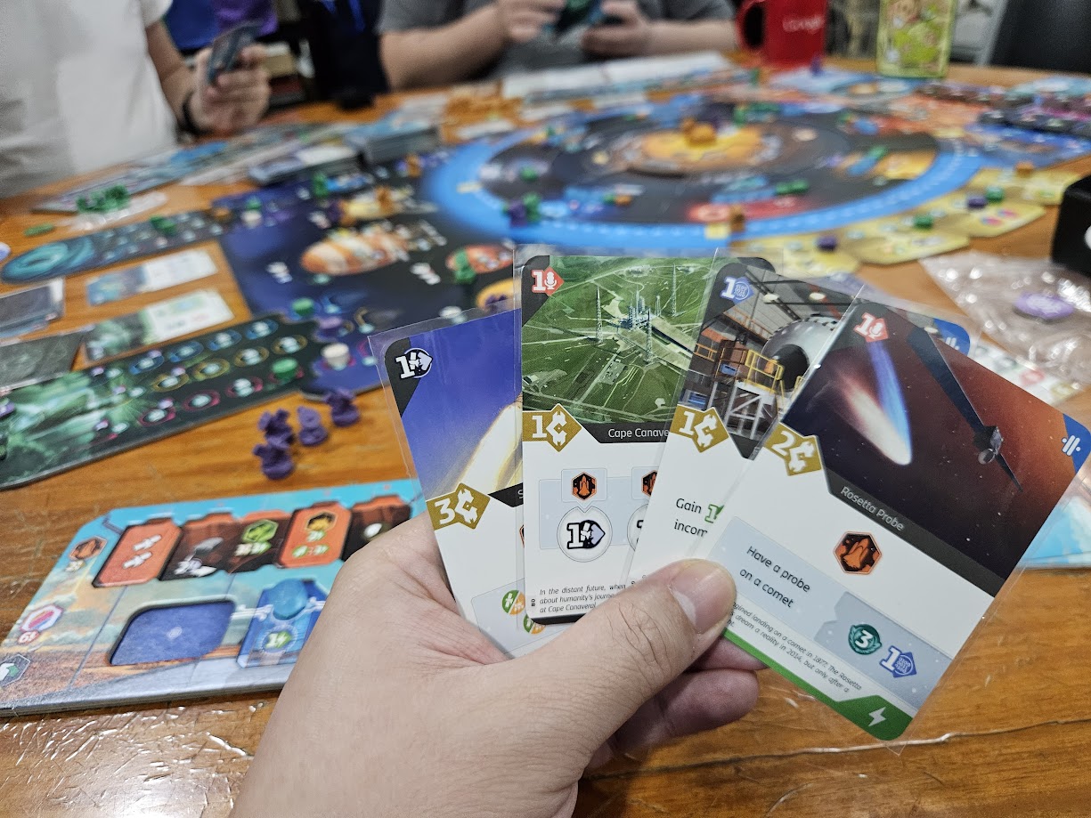 Gameplay photo of the board game SETI: Search for Extraterrestrial Intelligence featuring various components and board state.