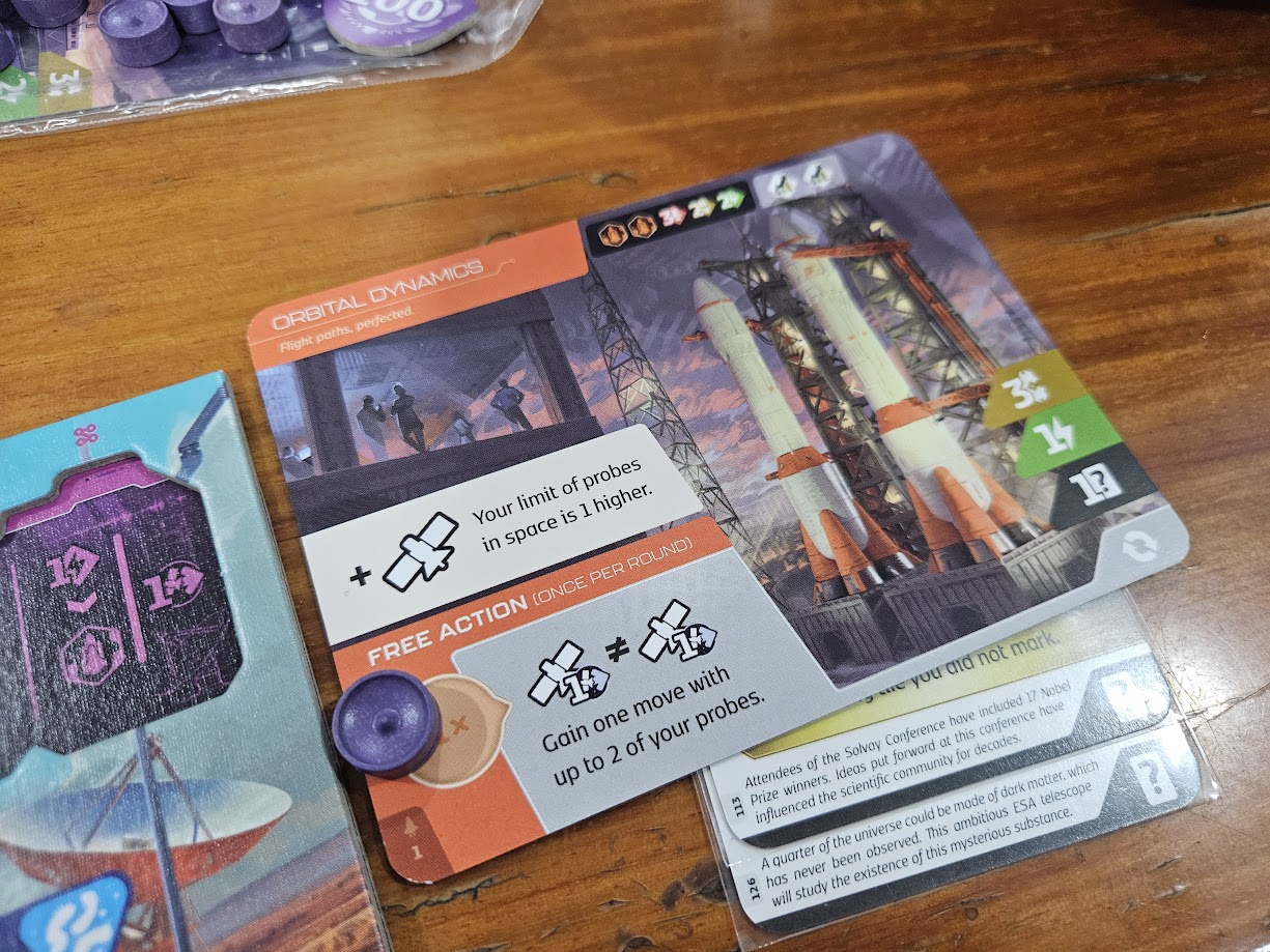 Gameplay photo of the board game SETI: Space Agencies featuring various components and board state.