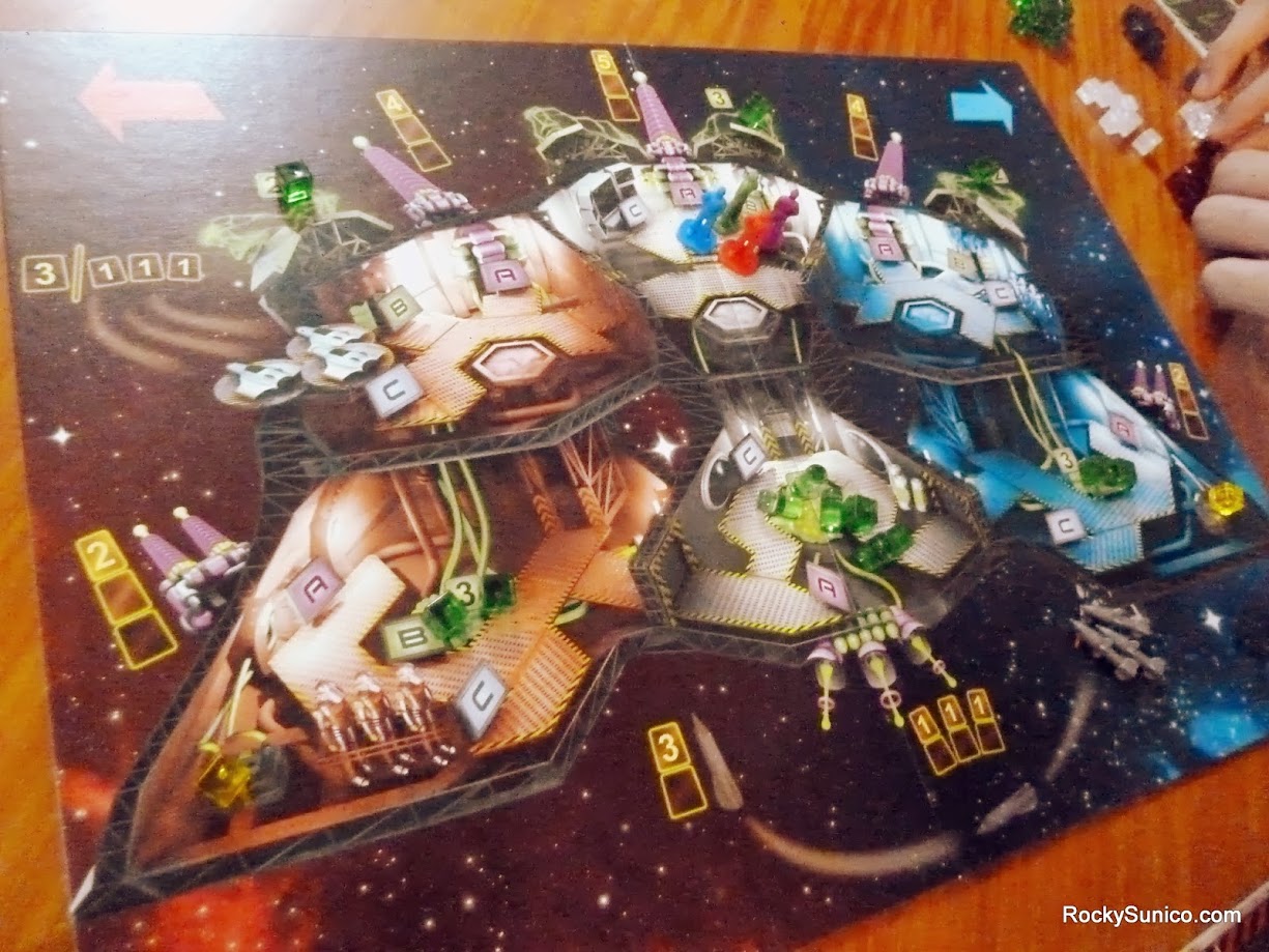 Gameplay photo of the board game Space Alert featuring various components and board state.