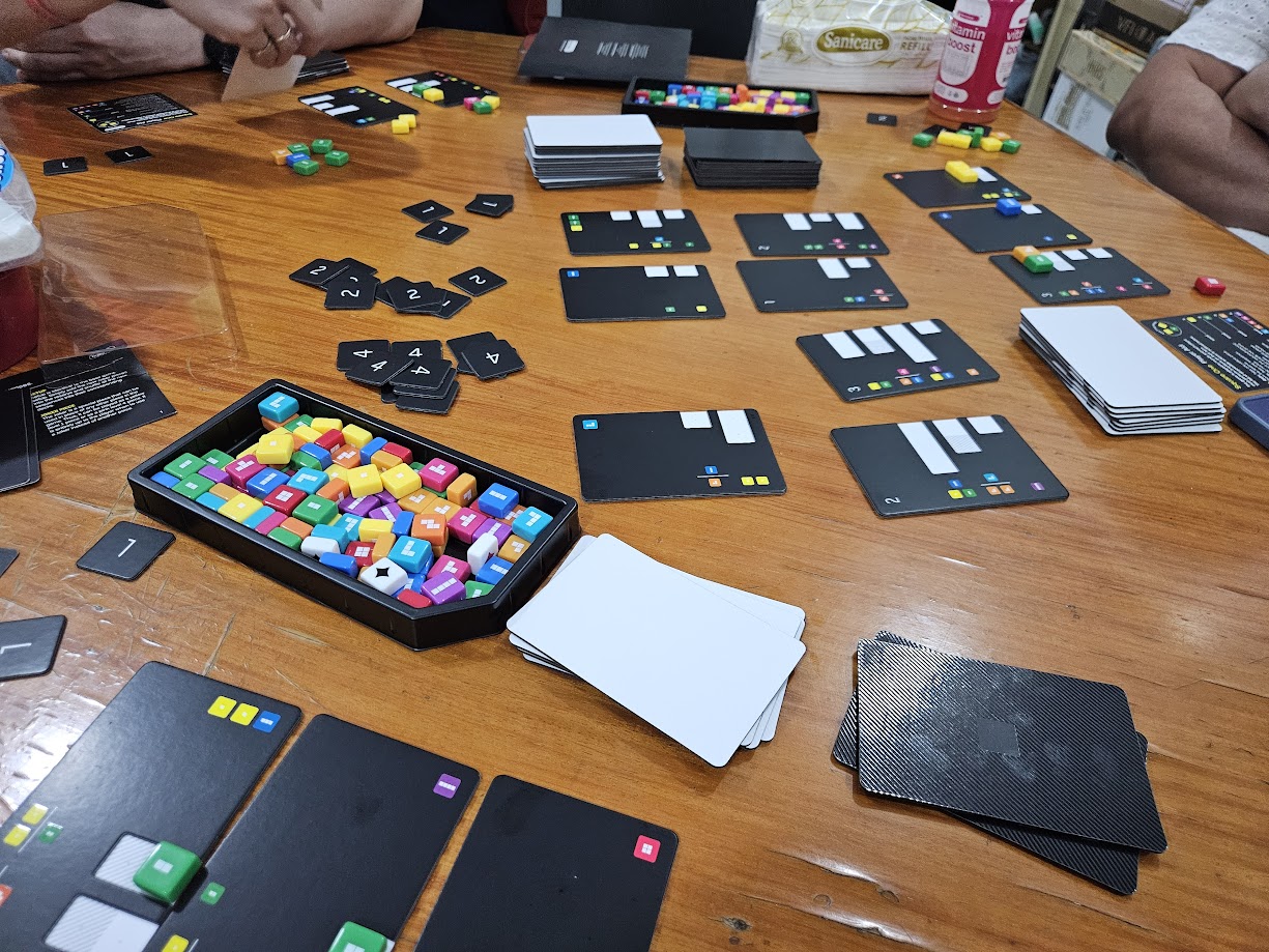 Gameplay photo of the board game Square One featuring various components and board state.