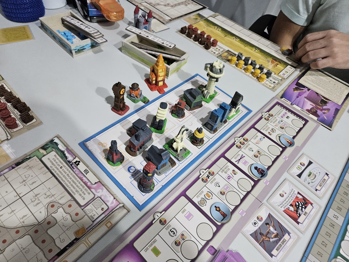 Gameplay photo of the board game Tapestry: Arts & Architecture featuring various components and board state.