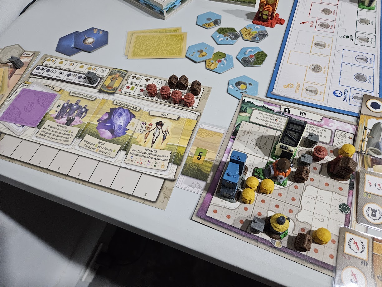 Gameplay photo of the board game Tapestry: Fantasies & Futures featuring various components and board state.