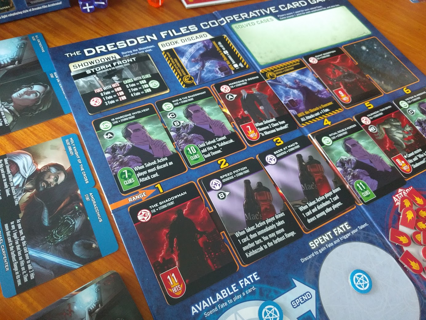 Gameplay photo of the board game The Dresden Files Cooperative Card Game featuring various components and board state.