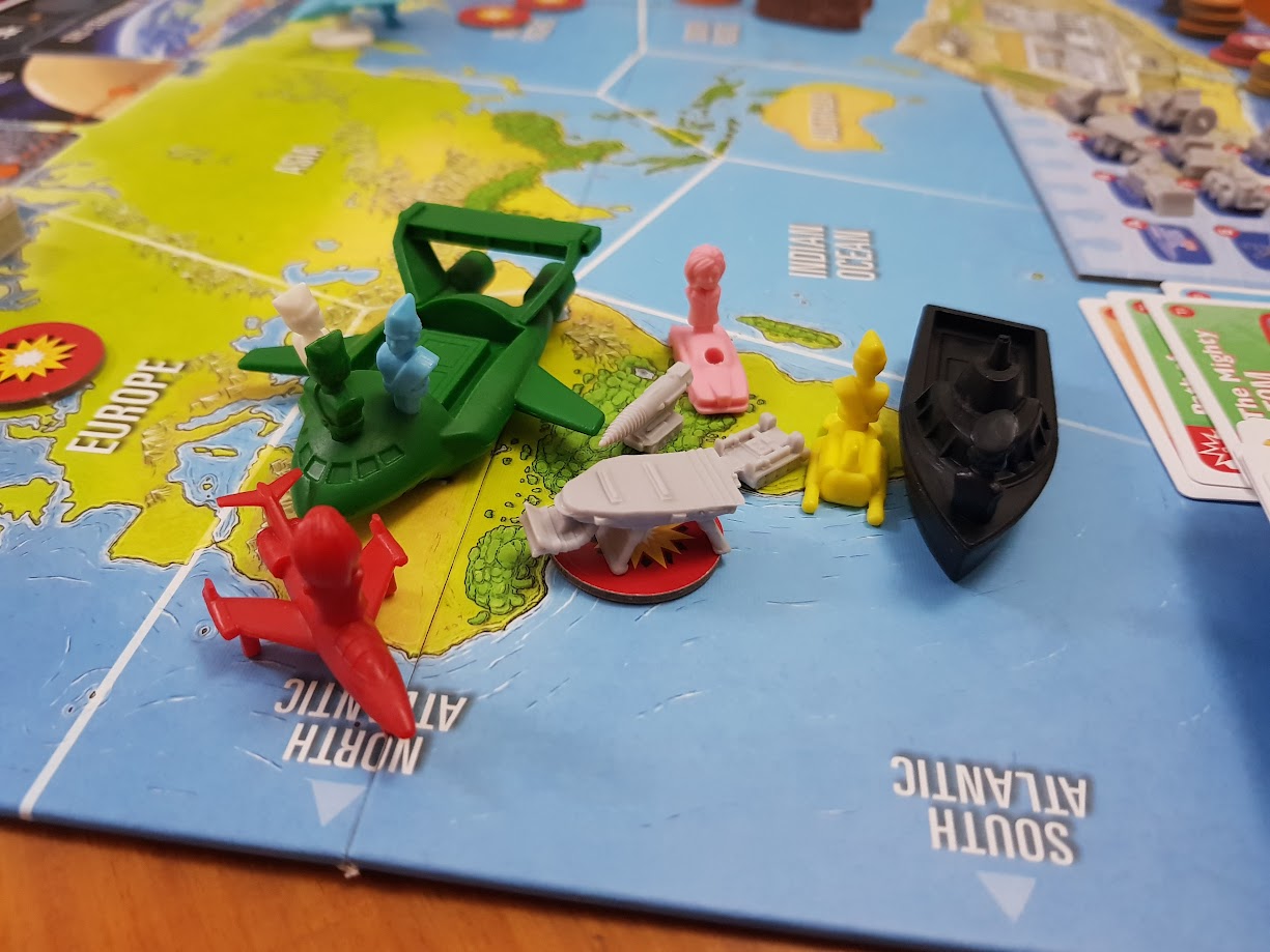 Gameplay photo of the board game Thunderbirds: Above & Beyond featuring various components and board state.