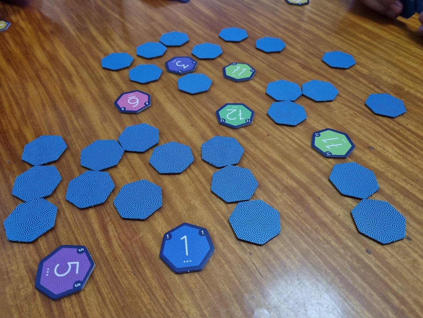 Gameplay photo of the board game Troika featuring various components and board state.