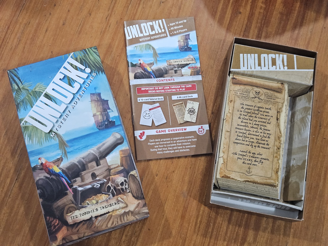Gameplay photo of the board game Unlock!: Mystery Adventures – The Tonipal's Treasure featuring various components and board state.