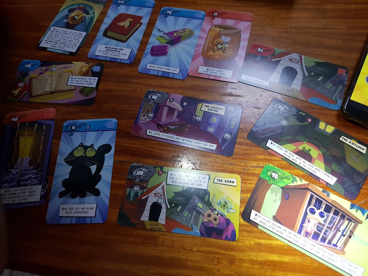 Gameplay photo of the board game Unlock!: Mythic Adventures featuring various components and board state.