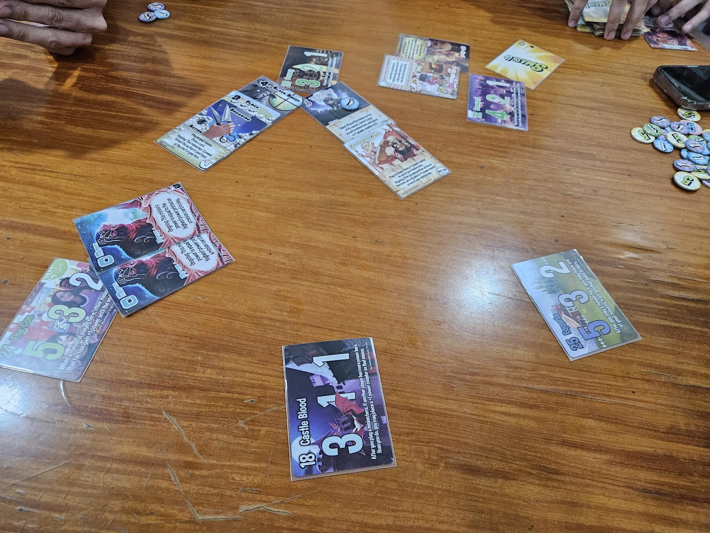 Gameplay photo of the board game Smash Up featuring various components and board state.