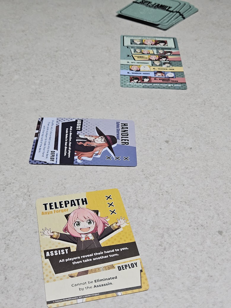 Gameplay photo of the board game SPY x FAMILY: Mission for Peanuts featuring various components and board state.
