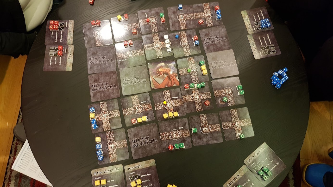 Gameplay photo of the board game Dice Crawl featuring various components and board state.