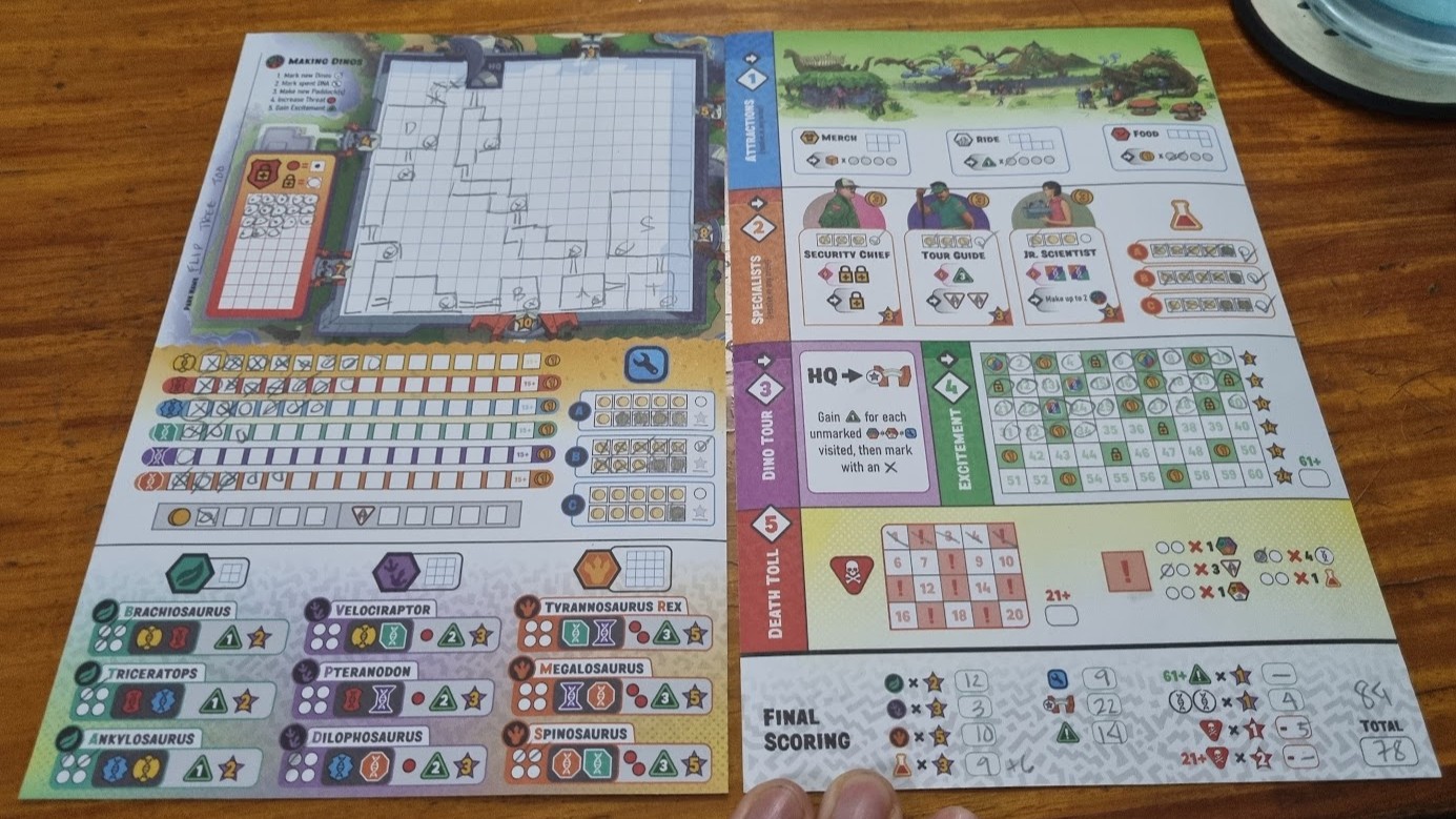 Gameplay photo of the board game Dinosaur Island: Rawr 'n Write featuring various components and board state.