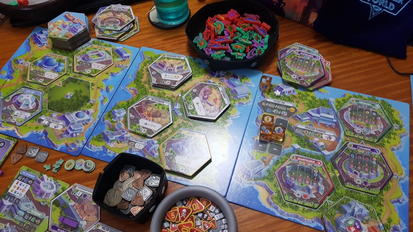 Gameplay photo of the board game Dinosaur World featuring various components and board state.