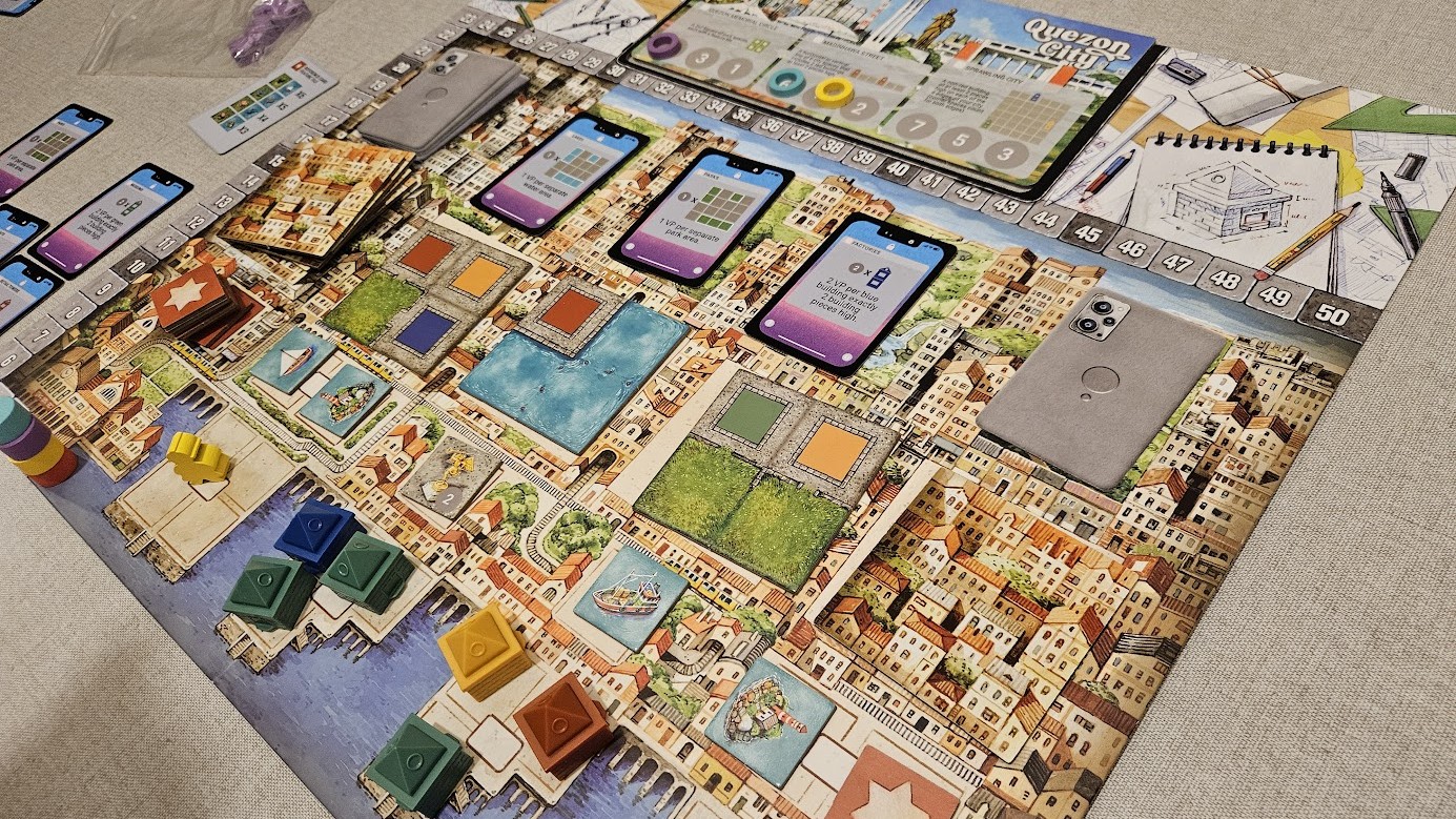 Gameplay photo of the board game Cities featuring various components and board state.