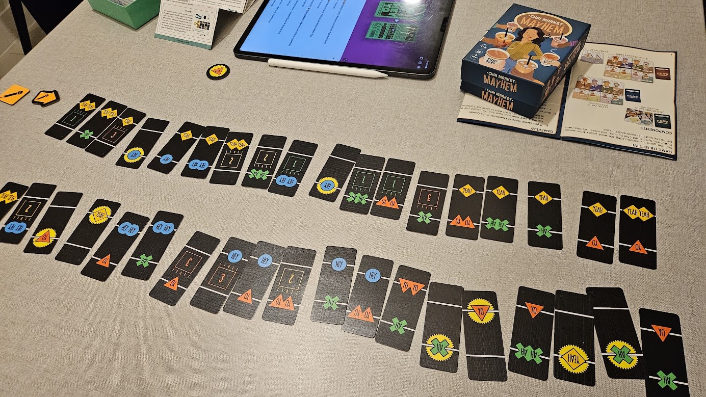 Gameplay photo of the board game Hey Yo featuring various components and board state.