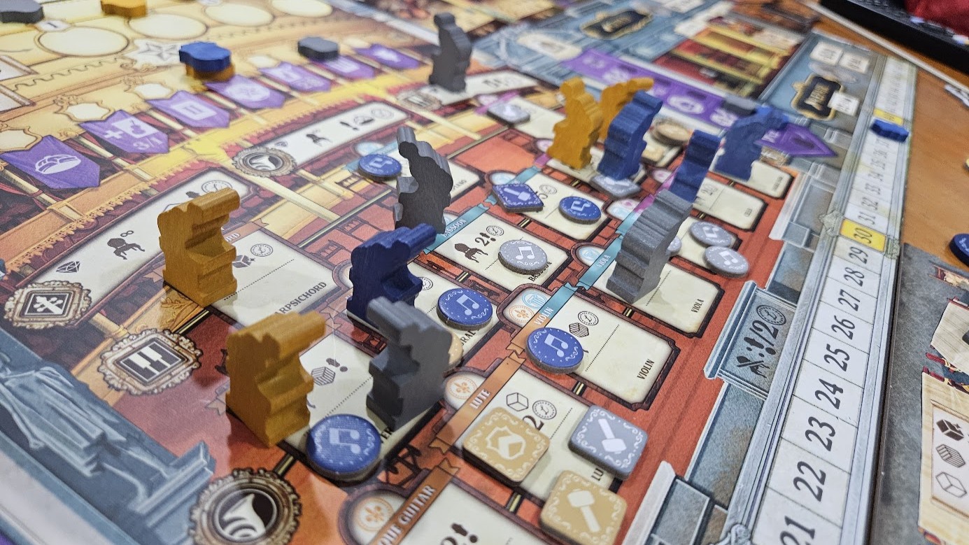 Gameplay photo of the board game Luthier featuring various components and board state.