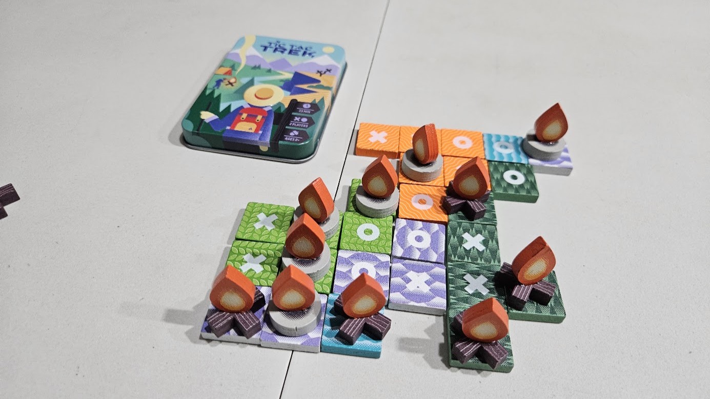 Gameplay photo of the board game Tic Tac Trek featuring various components and board state.
