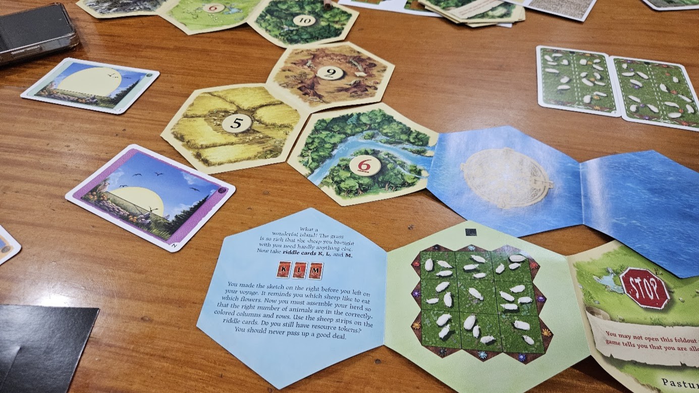 Gameplay photo of the board game EXIT: The Game – Adventures on Catan featuring various components and board state.