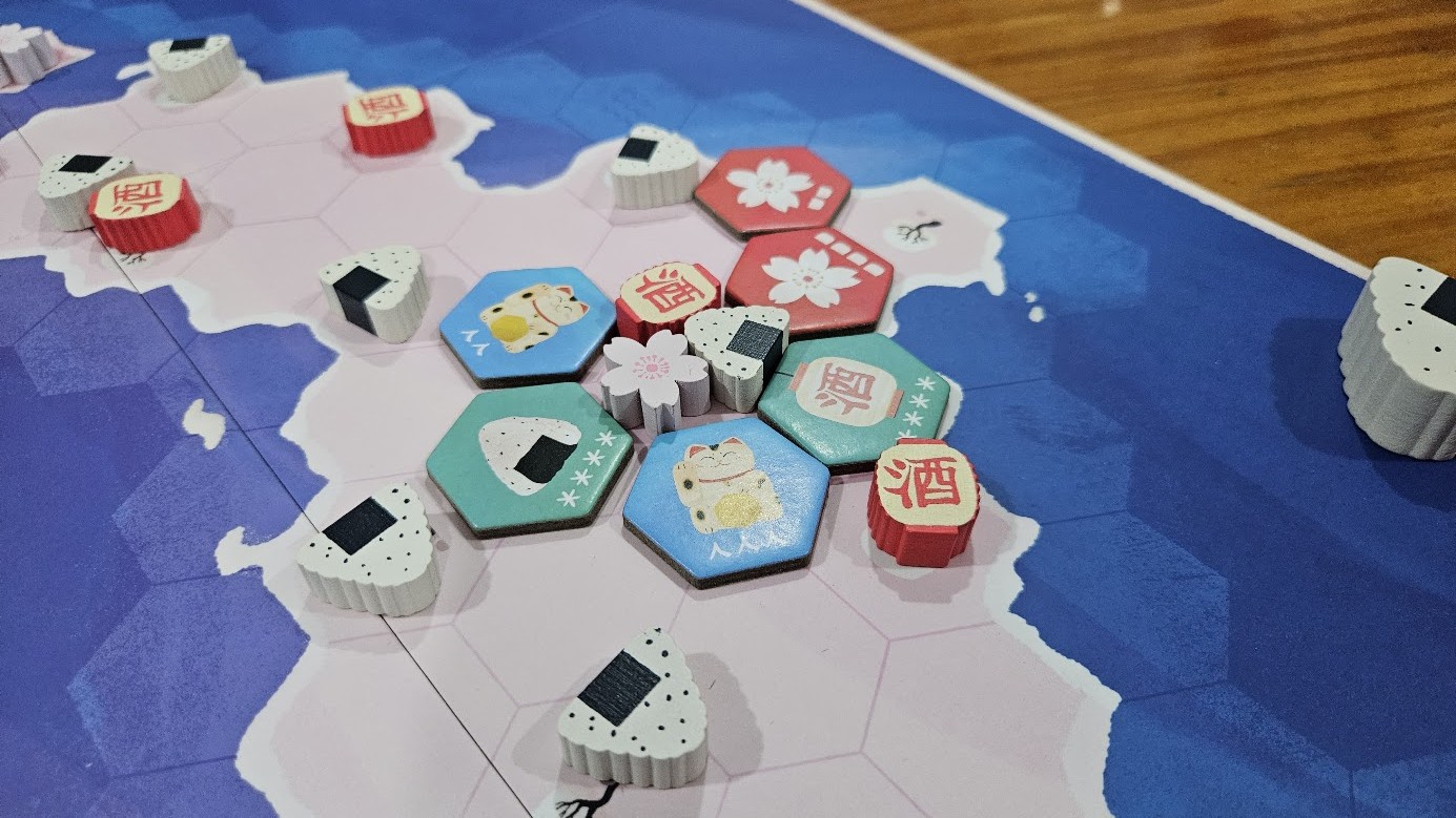 Gameplay photo of the board game Hanami featuring various components and board state.