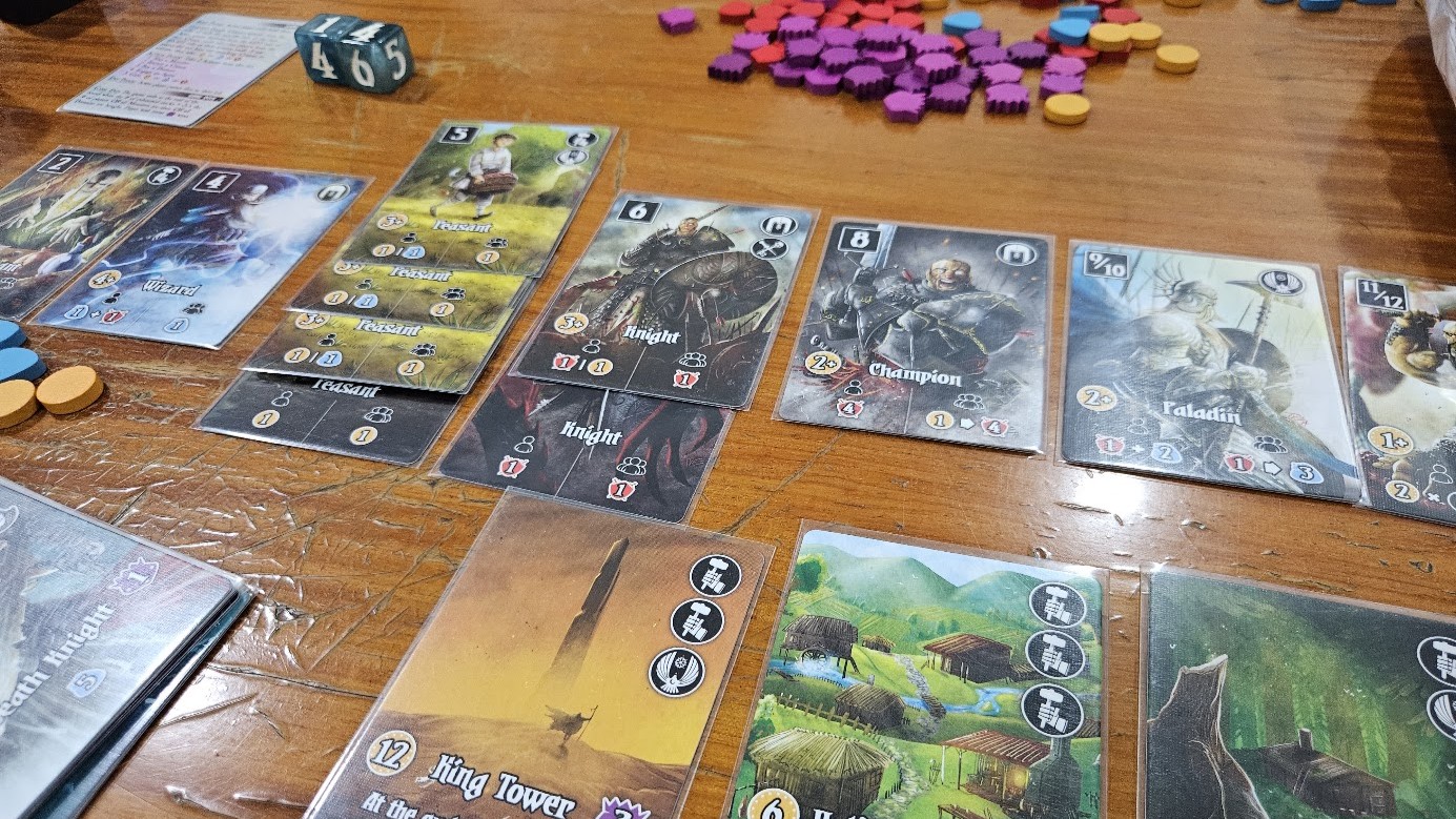 Gameplay photo of the board game Valeria: Card Kingdoms featuring various components and board state.