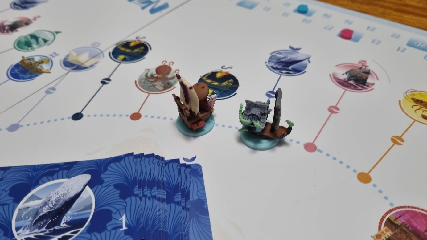 Gameplay photo of the board game Namiji featuring various components and board state.